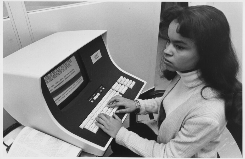 No original caption. (African-American woman computer operator) - NARA - 558656.tif