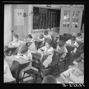 Interior view of a rural schoolroom with students at their desks in Cidra, Puerto Rico.