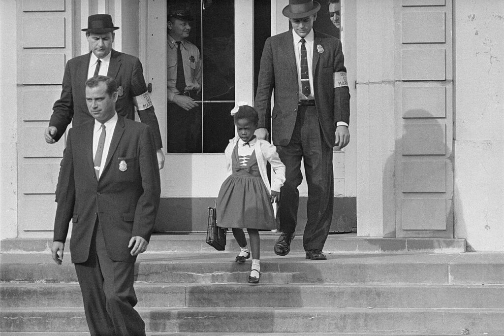 William Frantz Elementary School, New Orleans, 1960. U.S. Marshals escort Ruby Bridges to school.
