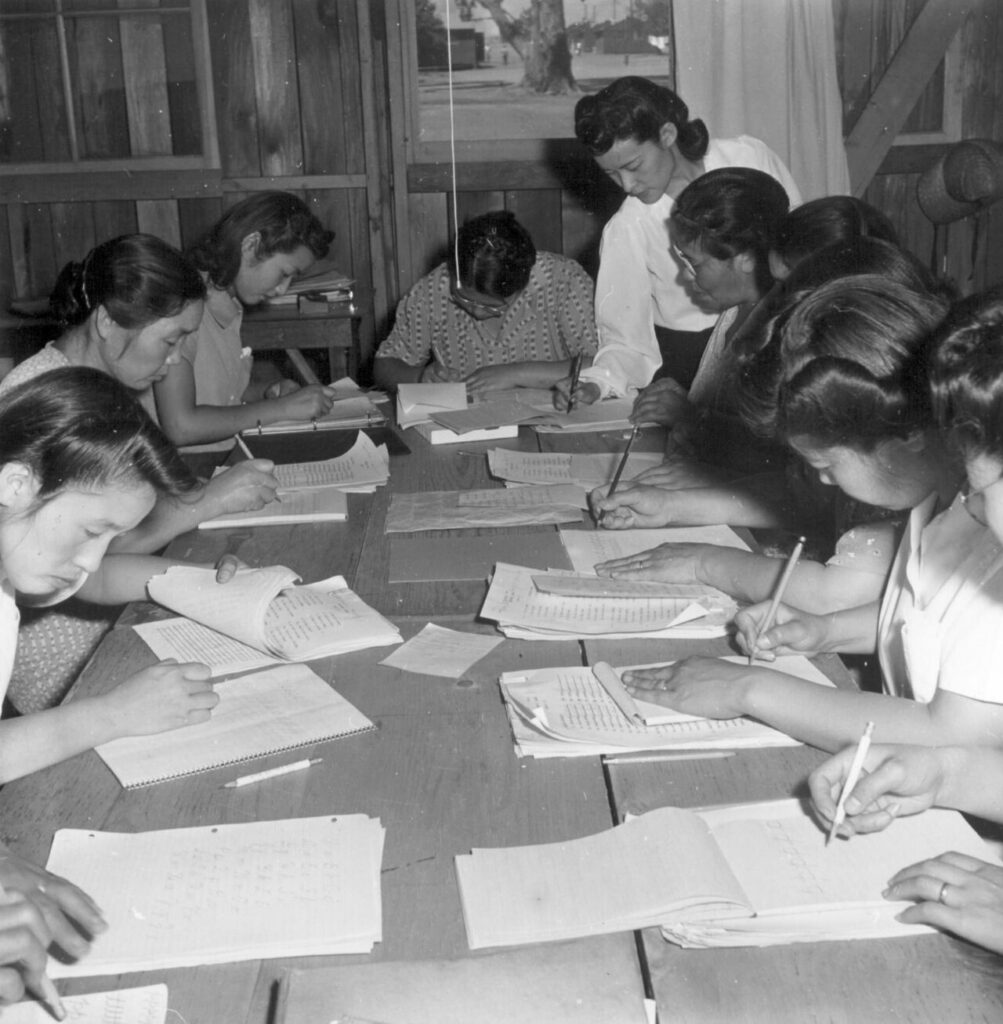 It is composed of Issei and Kibei evacuees who are studying the Ideals of American Citizenship and the English language with which they are unfamiliar. At this time there are 18 su