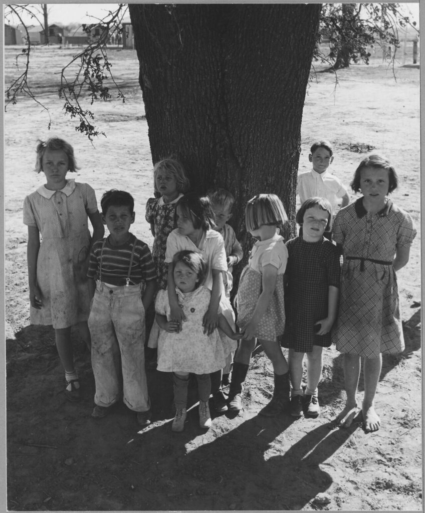 Scope and content: Full caption reads as follows: Near Yuba City, California. Children of migrant workers in Yuba City Agricultural Farm Workers Community. Spring afternoon, after